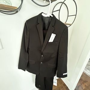 Formal suit coat with pants. Brand new never worn. Boys size 16.